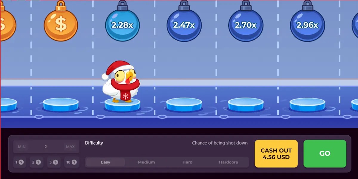 Screenshot of a winter-themed Chicken Road-style game showing a chicken in a Santa hat on icy stepping stones, with hanging multiplier bombs above (2.28x, 2.47x, 2.70x, 2.96x) and a bottom panel for bets and difficulty plus “CASH OUT 4.56 USD” and a green “GO” button.